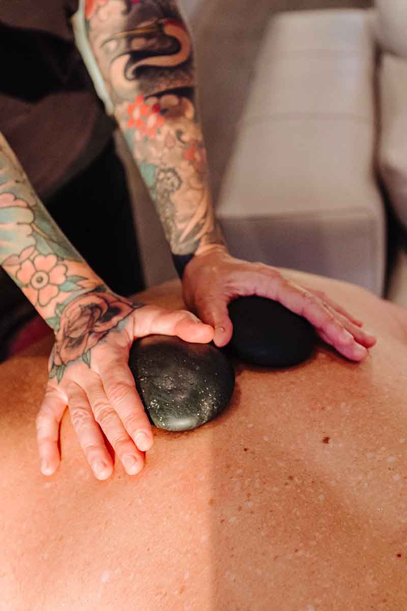 Hot stones application to a massage